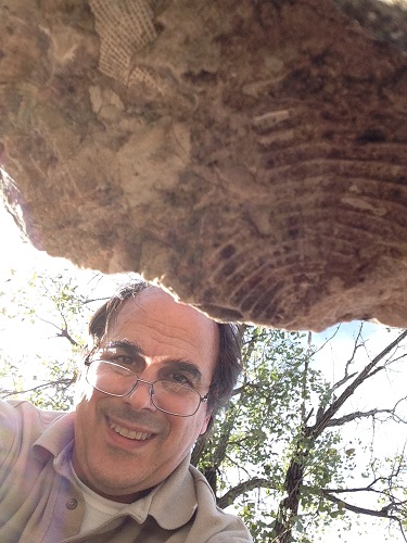 Alan's selfie with an under-the-ledge trilobite.