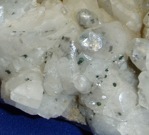 Calcite with chalcopyrite coated with green malachite - close up photo