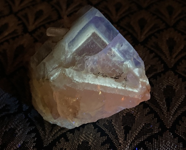 Fluorite with a fluorescent phantom of petroleum inclusions. Clement Mineral Museum specimen.