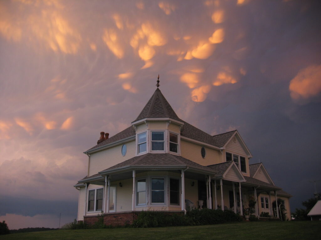 A house in Crittenden County, Kentucky, with mammatus clouds at sunset.