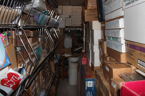Flats of minerals and fossils shelved in Bob Robinson's basement. 
