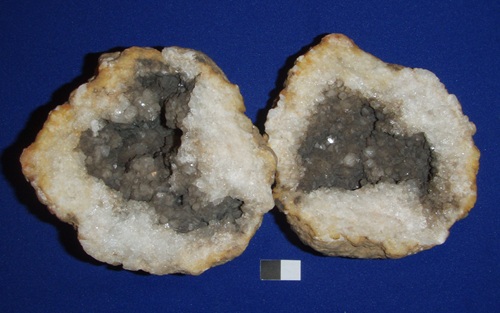 A geode with manganese oxide coating quartz. Iron coatings are in shades of red, orange, yellow, and brown. Collected in Meade Co., KY in the late 1970s or early 1980s. Geode #3 in the Goldstein collection. 