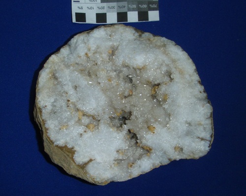 Small clusters of dolomite crystals are scattered in this quartz geode from Meade Co., KY. Collected in the fall of 1995.