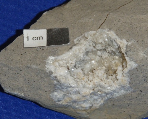 A calcite geode in Salem Limestone, from the dump of the Hutson Zinc Mine in Livingston Co., KY. Crystals are small and blocky. 