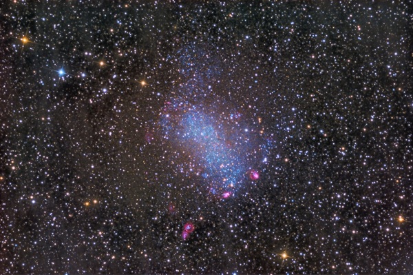 Barnard's Galaxy, NGC 6822 is a dwarf irregular galaxy with an appearance similar to the Small Magellanic Cloud. NASA photo.