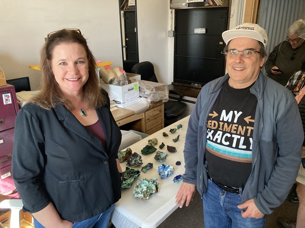 Annie Larkin, the museum director, and I stand with the KSC minerals in the two rows between us. The other minerals are from their collections.