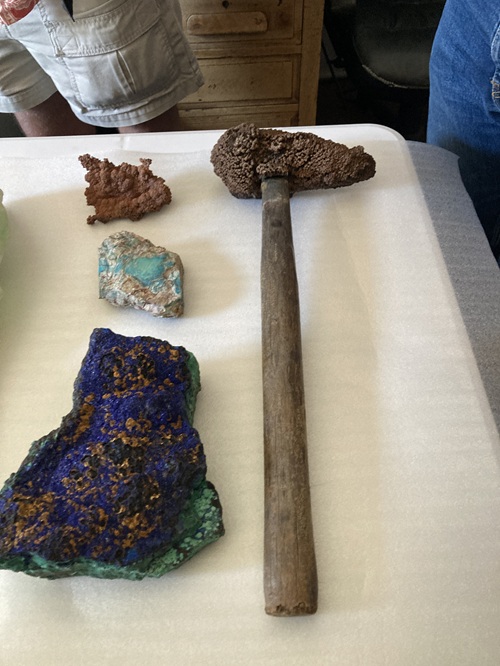 A hammer coated with post-mine (obviously!) native copper deposited by groundwater. Native copper is not found in the deposits at Bisbee. Other specimens include azurite on malachite, turquoise, and another late-native copper.