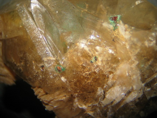 Photo Mal1, Malachite coating oxidized chalcopyrite in fluorite and calcite. FOV ~25mm