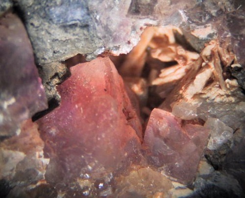 Photo Cr1, Chalky white cerussite crystals with pink fluorite, from Conn's mine, Pope Co., IL. Collected in 1984. FOV ~35 mm