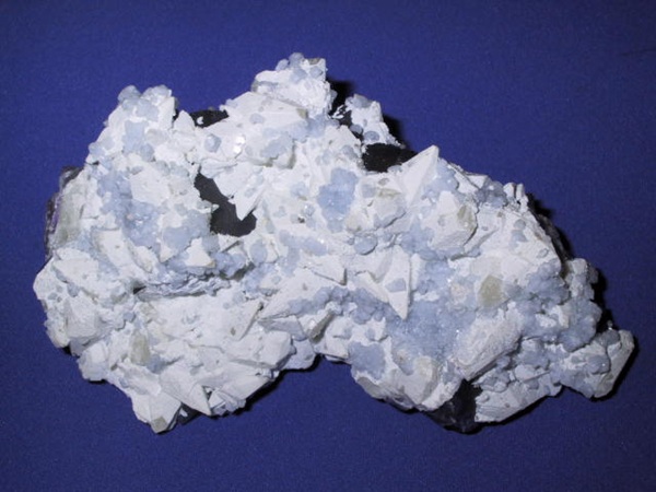 Photo Cl1, Celestine on white barite-coated calcite on fluorite from the Annabel Lee mine. Obtained in spring 1988 for $35.