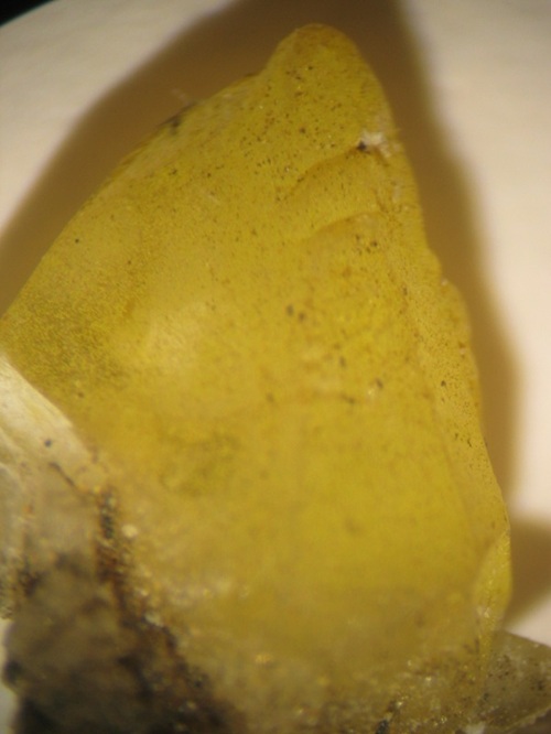 Photo Gr2, Greenockite colored calcite from the Columbia mine. Crystal is about 6 mm long.