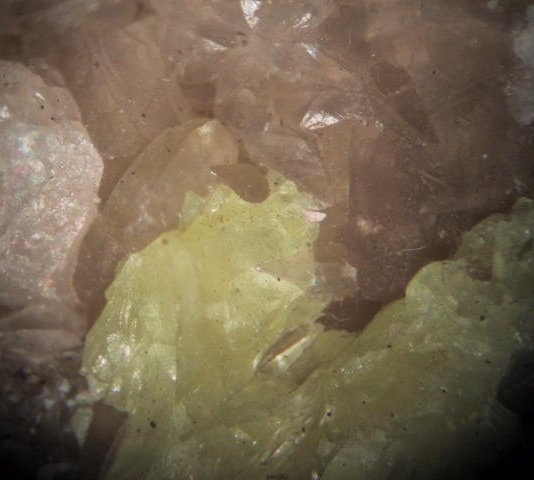 Photo S2, sulfur and calcite crystals, a drill core found by the Victory Mill dump. FOV = 30 mm
