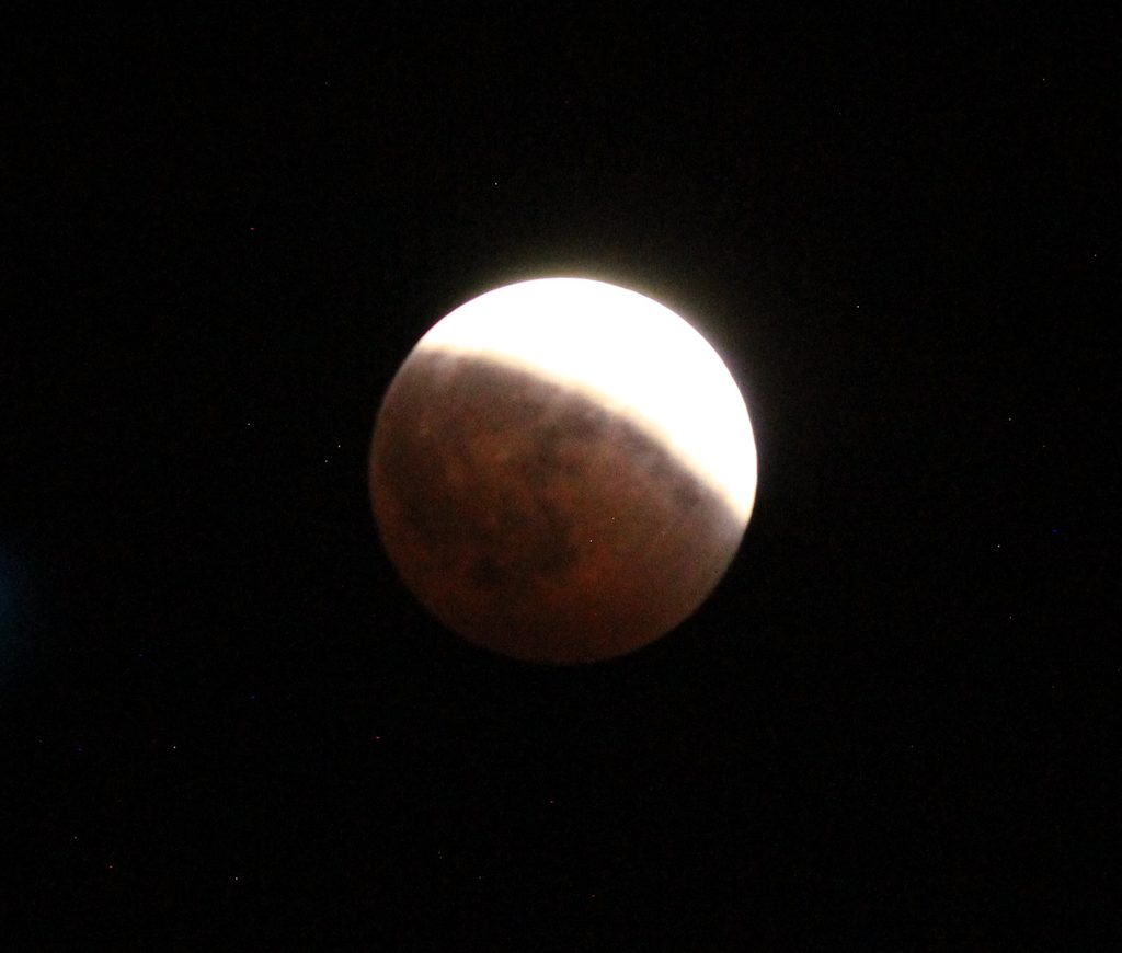 This was the eclipse when the moon looked spherical. The subtle shades are not possible with a camera.