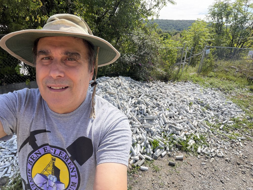 I'm standing next to the core dump, dominated by cores of the Franklin Marble. I collected one that was drilled from 2,600-feet underground. 
