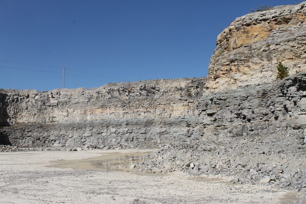 Limestone, limestone everywhere - and crystals are hard to find! The white rock is called oolitic limestone, about 95% calcium carbonate. Great for power plant scrubbers...